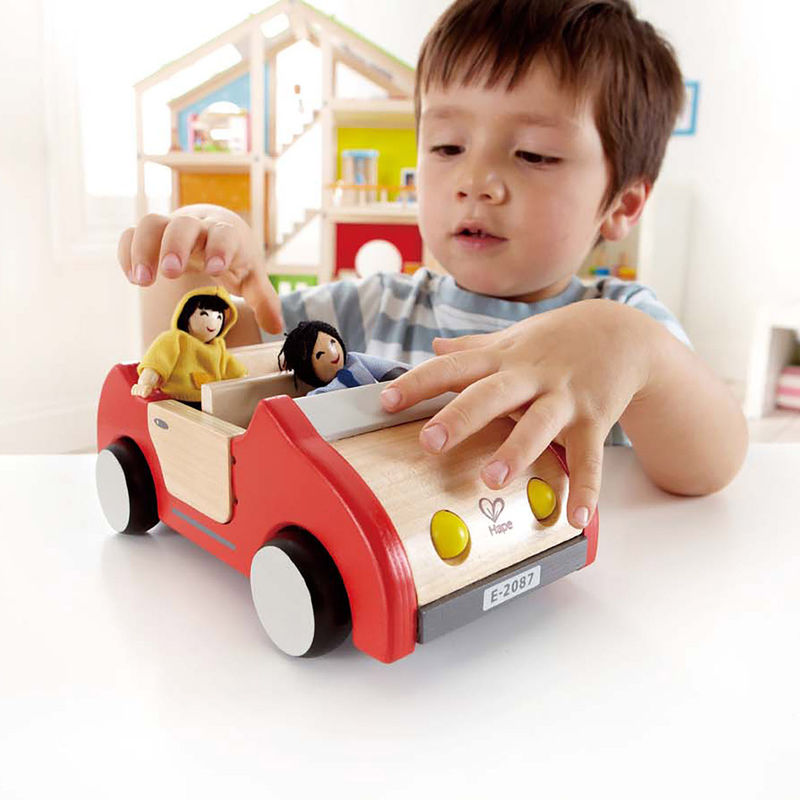 kid playing with toy car