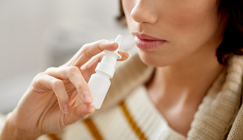 woman-using-nasal-spray