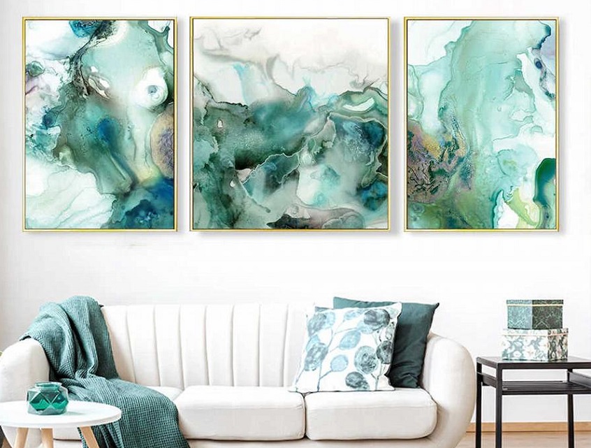 Watercolour art prints above a sofa