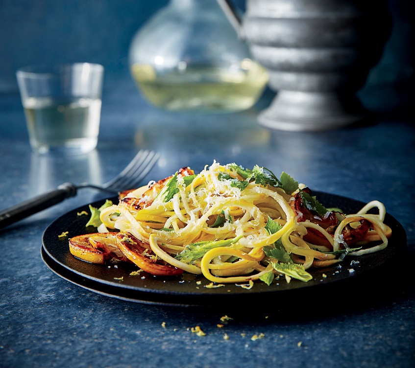 gluten free pasta on a black plate