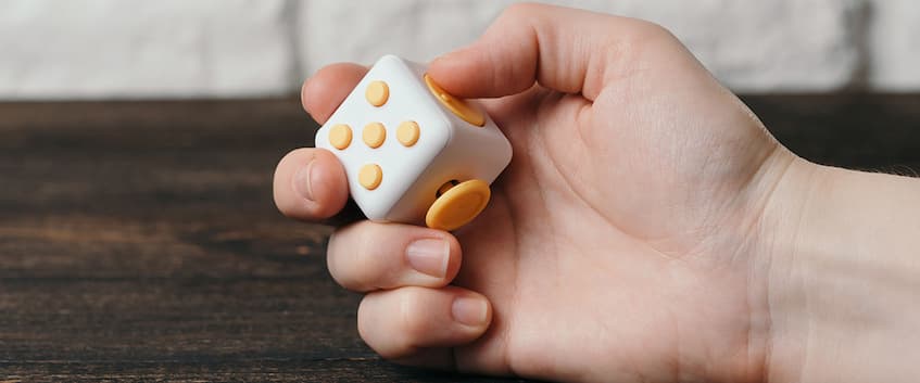 Child holding a fidget toy