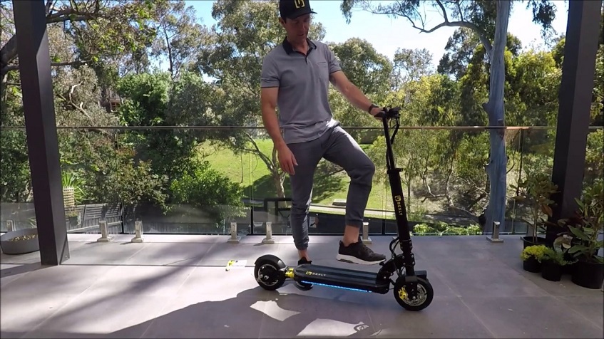 man stepping on Bexley scooter