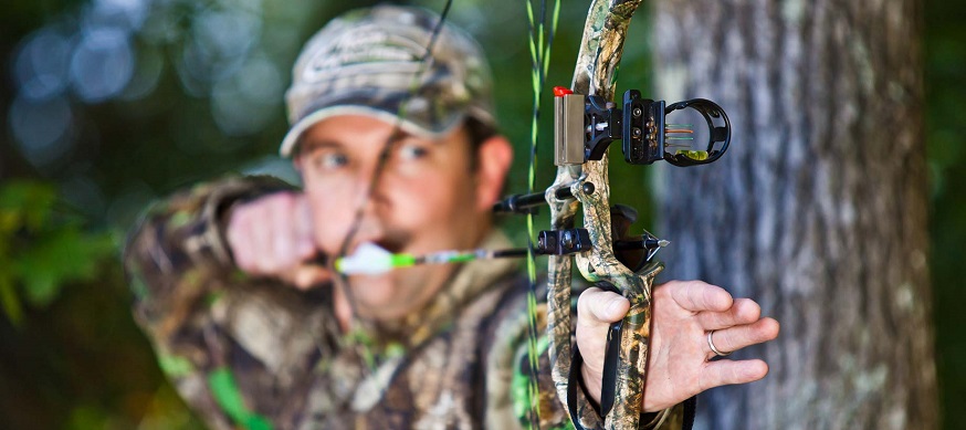 close-up of hunter aiming with bow