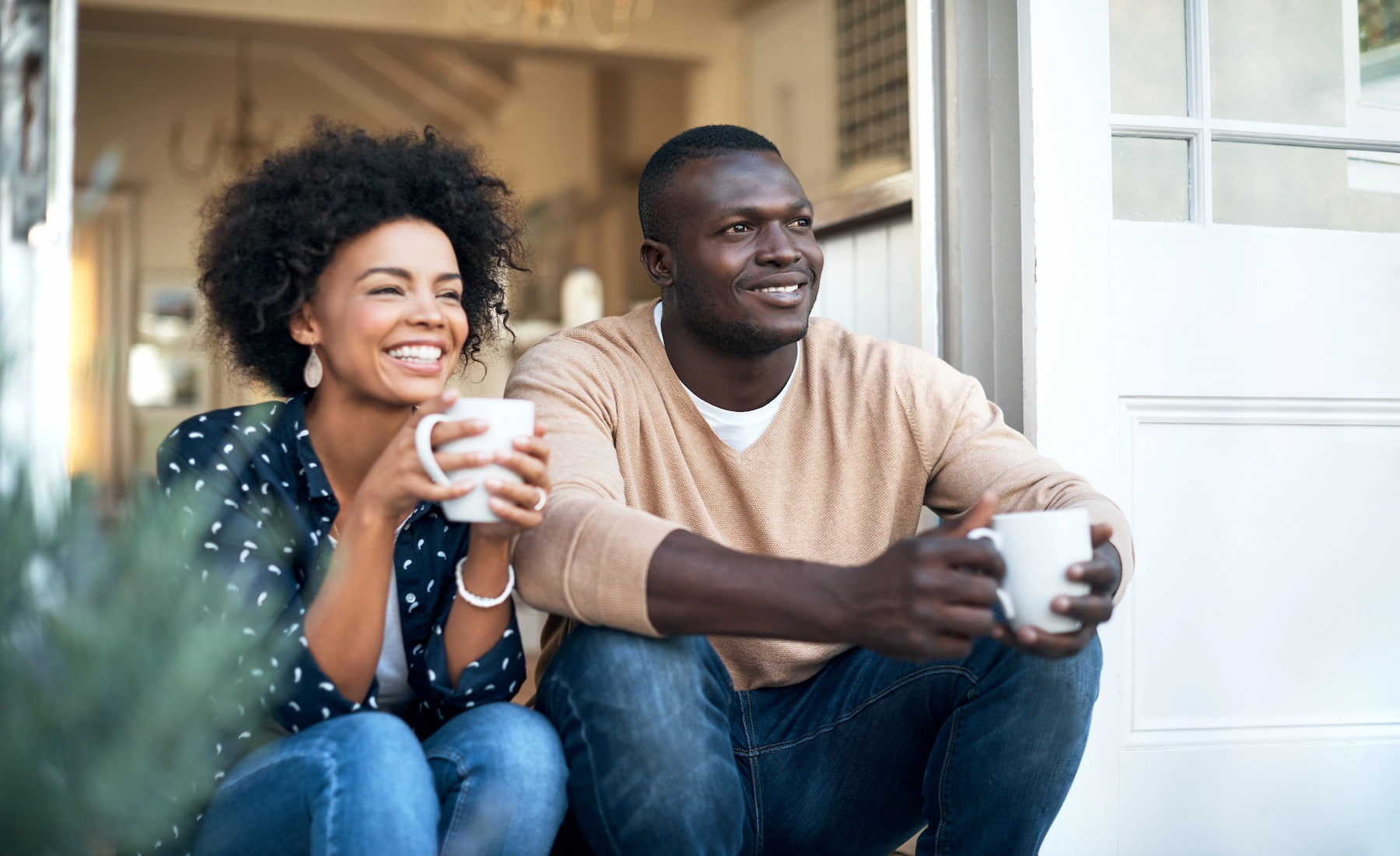 couple sitting on front deck