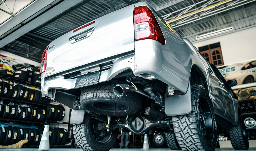 Toyota Hilux with performance exhaust in mechanic garage