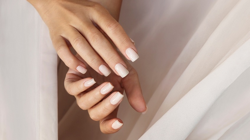 photo of woman's hands with a fresh set of acrylic nails