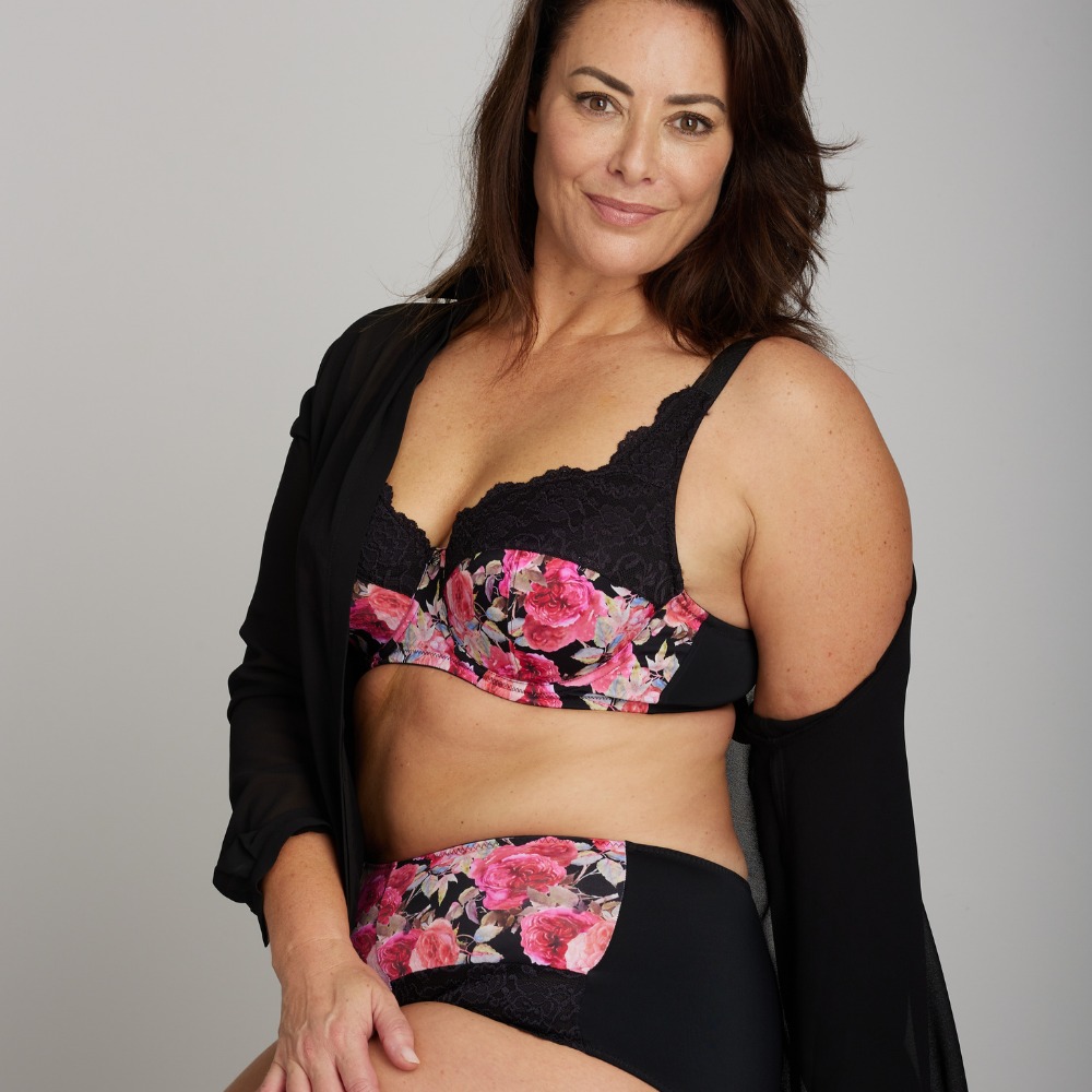 A woman wearing a matching underwear set