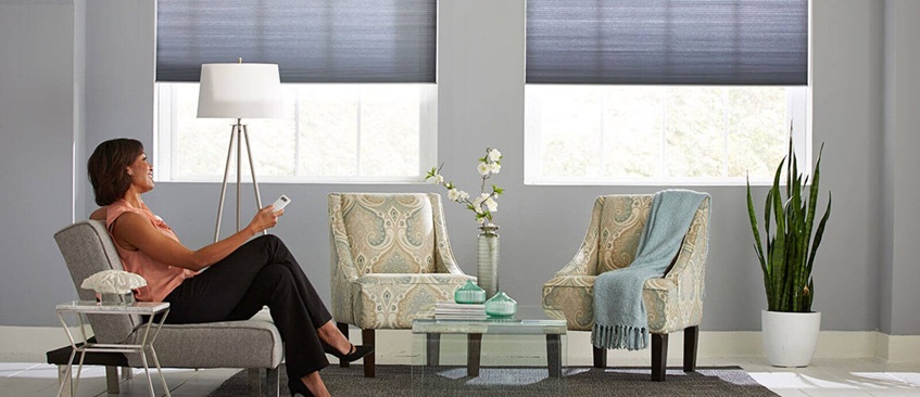 woman turning smart blinds